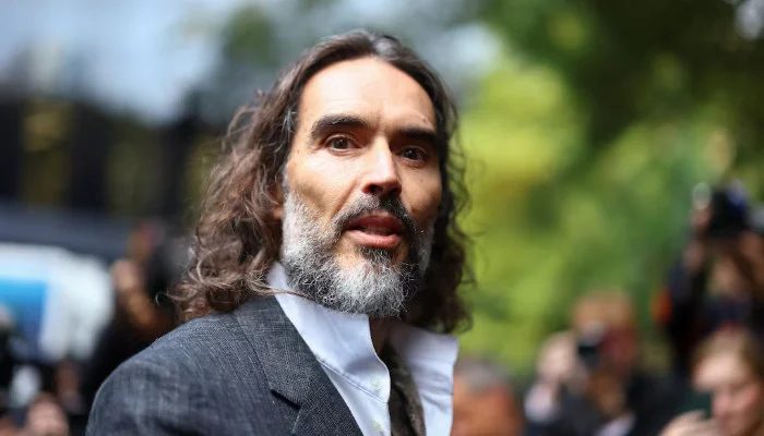 Russell Brand leans on wife amid high-stakes sexual assault trial